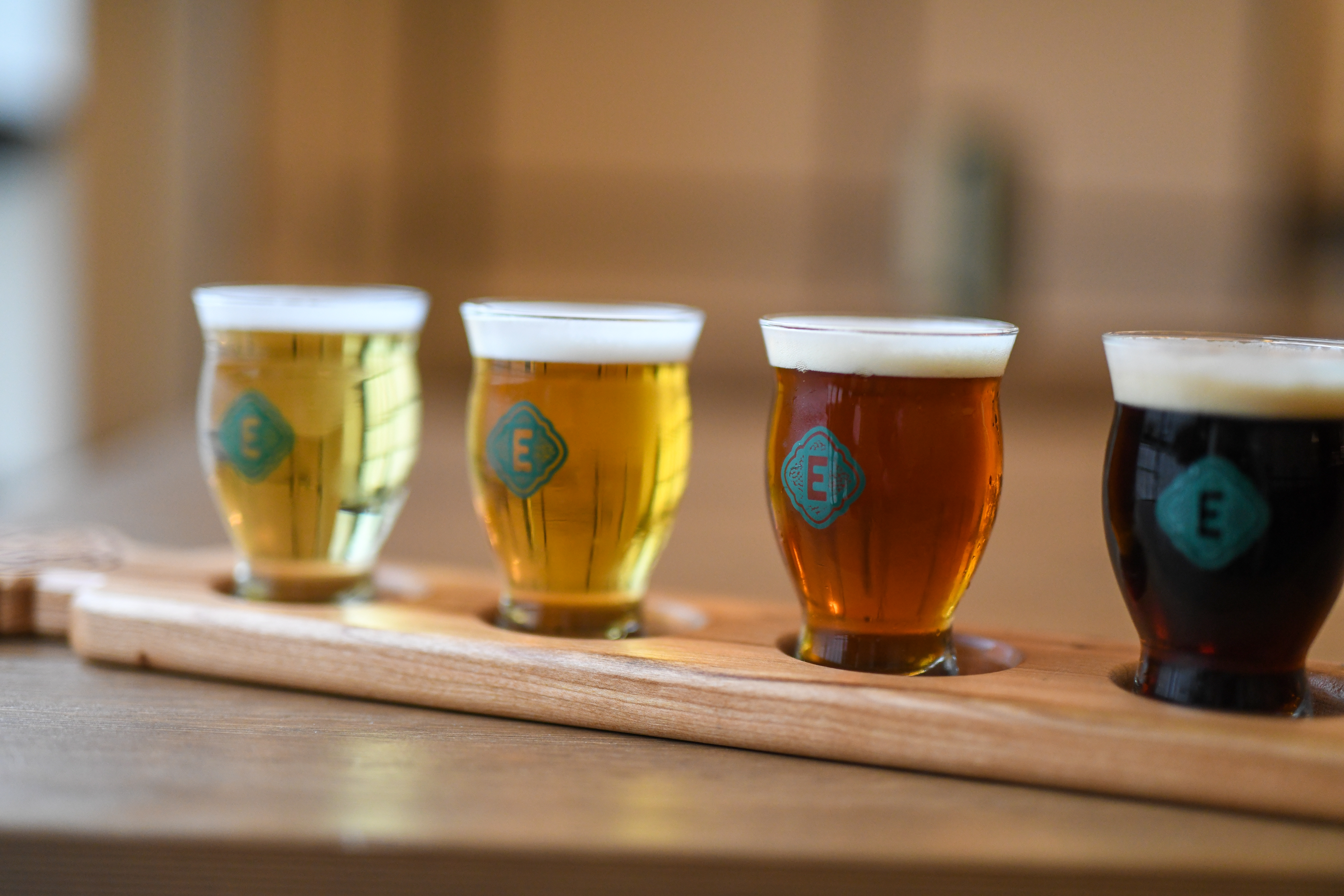 Flight of four Eckhart Beer Co. beers ranging from pale lager to dark lager