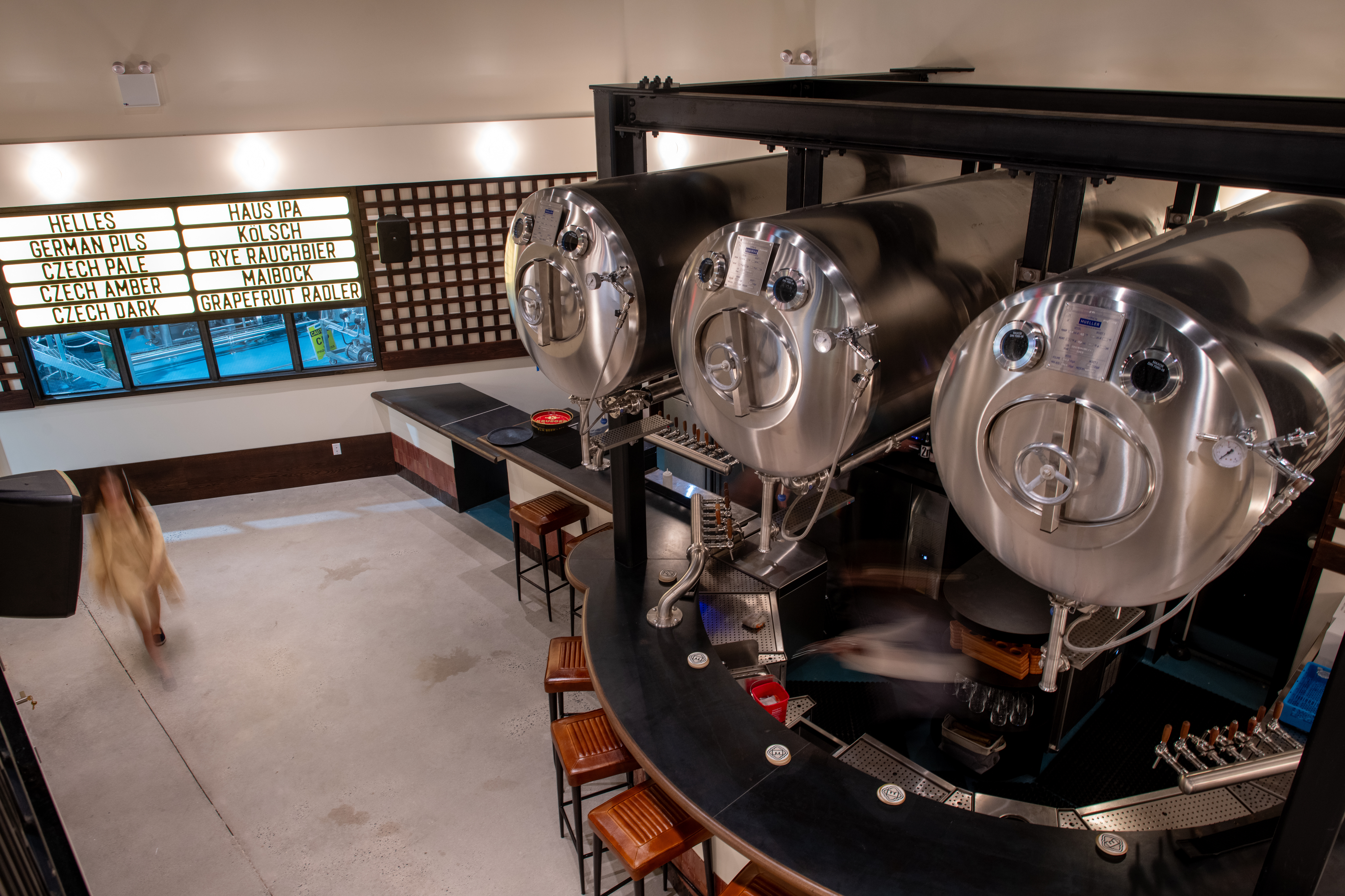 Overhead view of Eckhart Beer Co.'s taproom bar and fermentation tanks